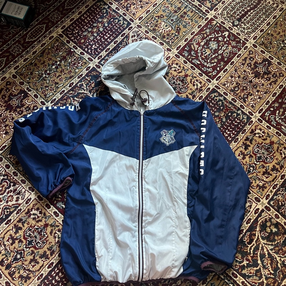 Blue and white Hogwarts windbreaker with a warm lining inside with the hood
